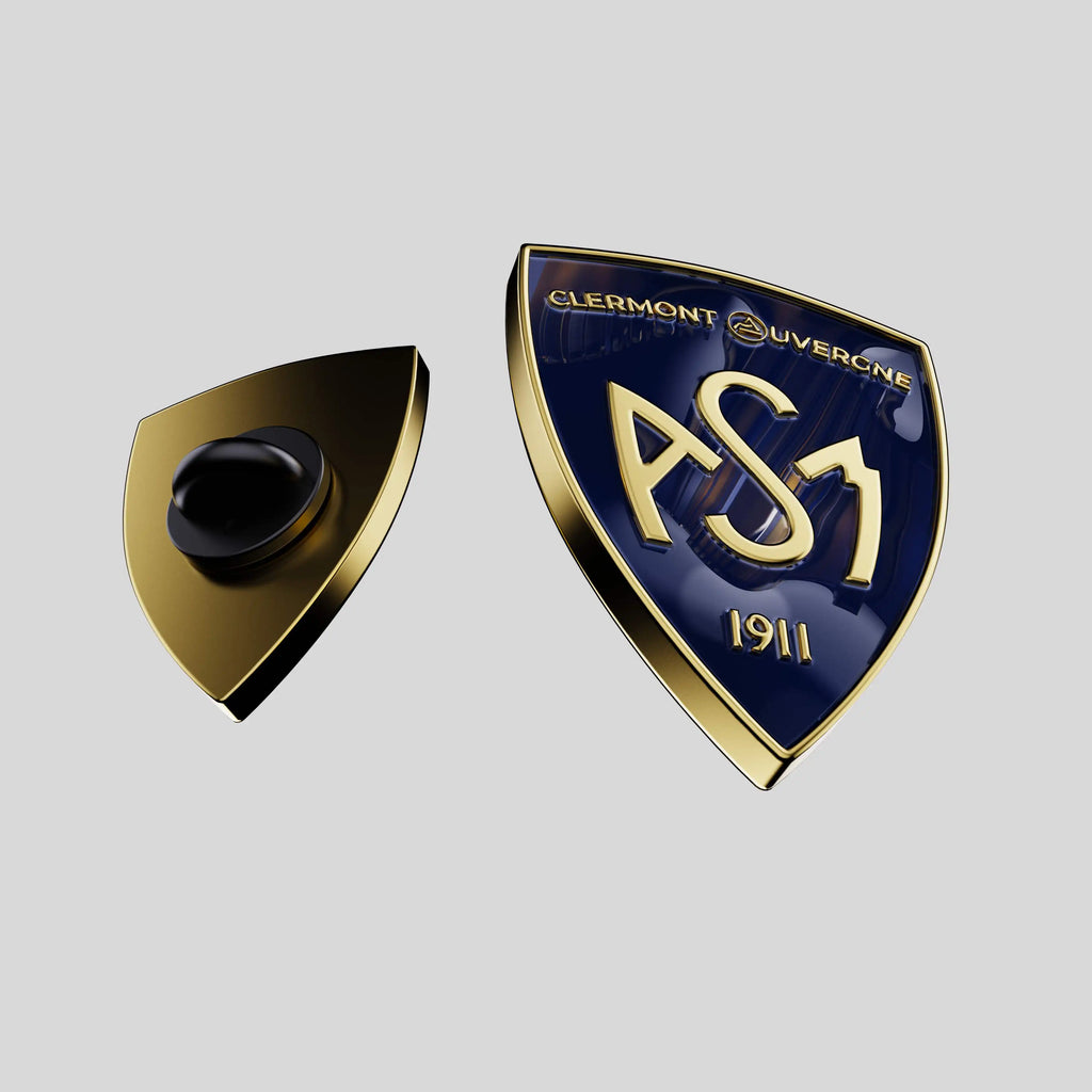 pin's en or en forme de blason émailage bleu et relief