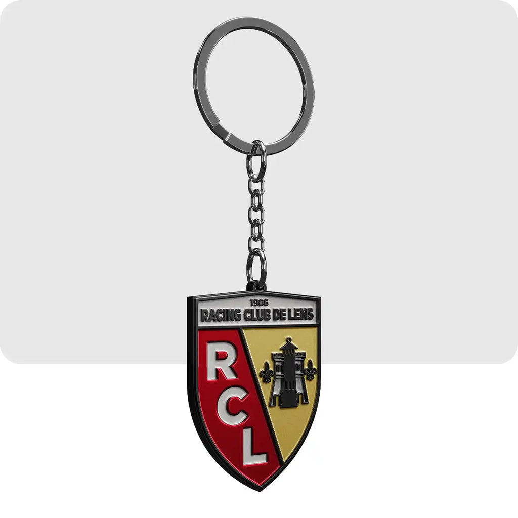 Porte clé gravé de couleur blanc, jaune et rouge représentant le logo de l'équipe de football de Lens.