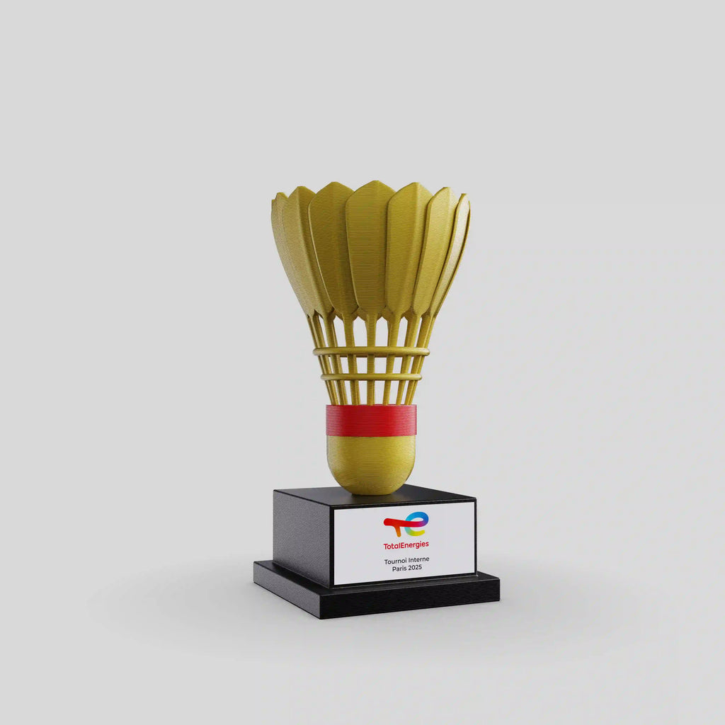 trophée 3D d'un volant de badminton noir et doré