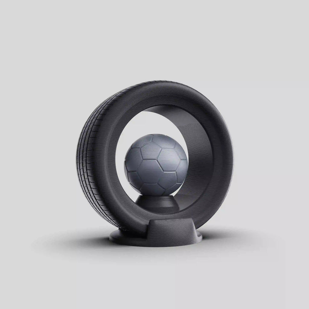 trophée en impression D à la forme d'un pneu avec un ballon de football dedans